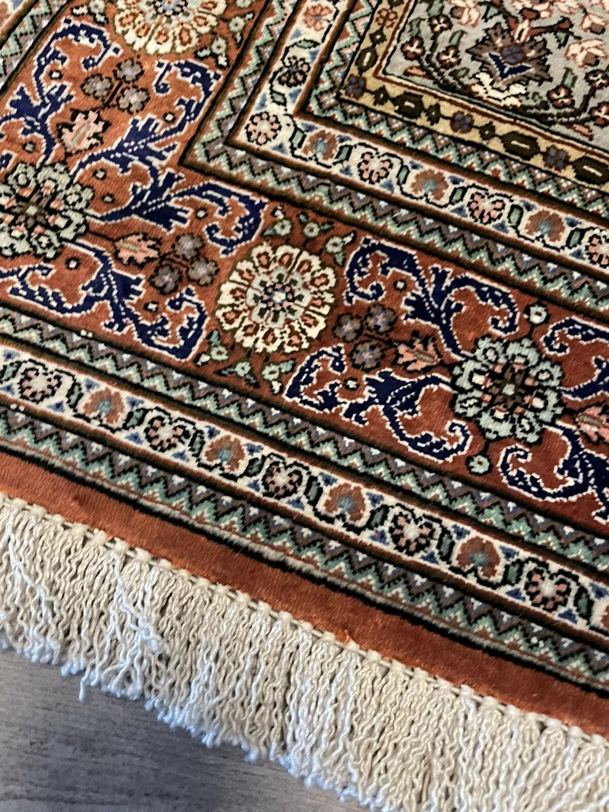 Fine craftsmanship of a handmade Persian Qum rug
