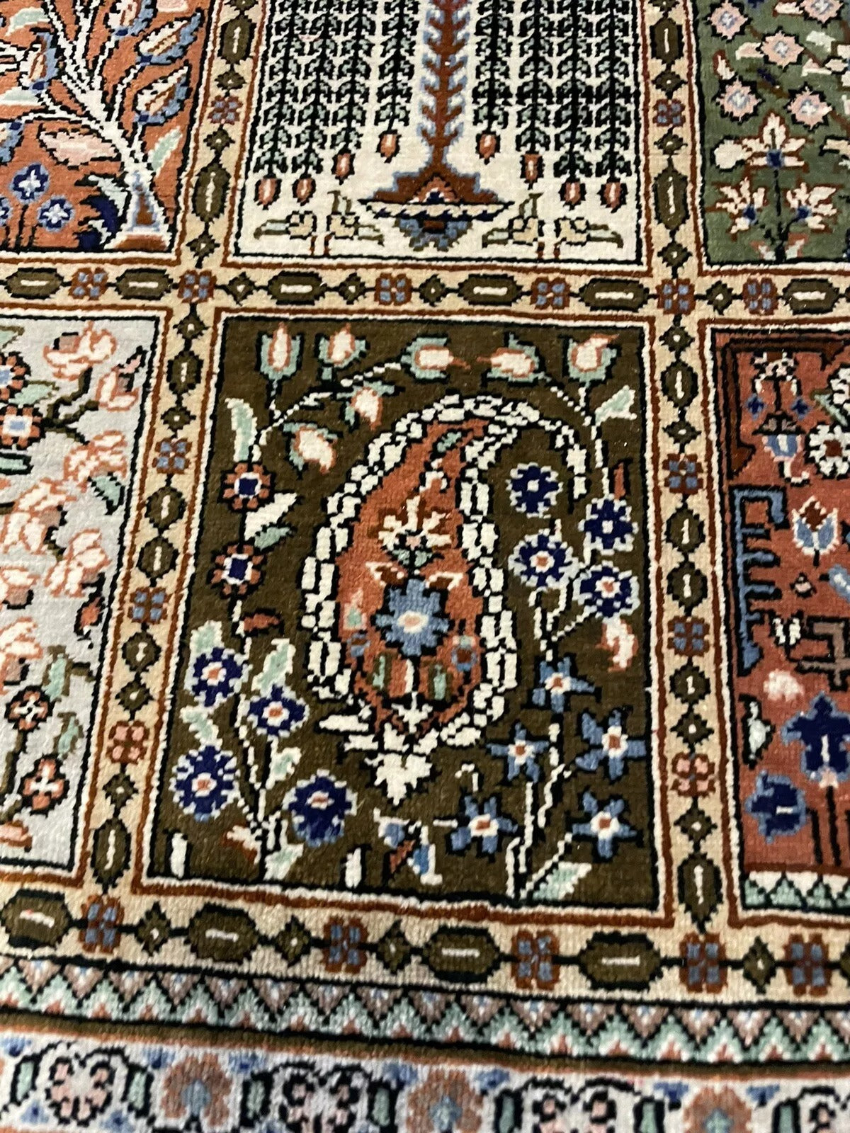 Lustrous silk texture of a high-quality Persian Qum carpet
