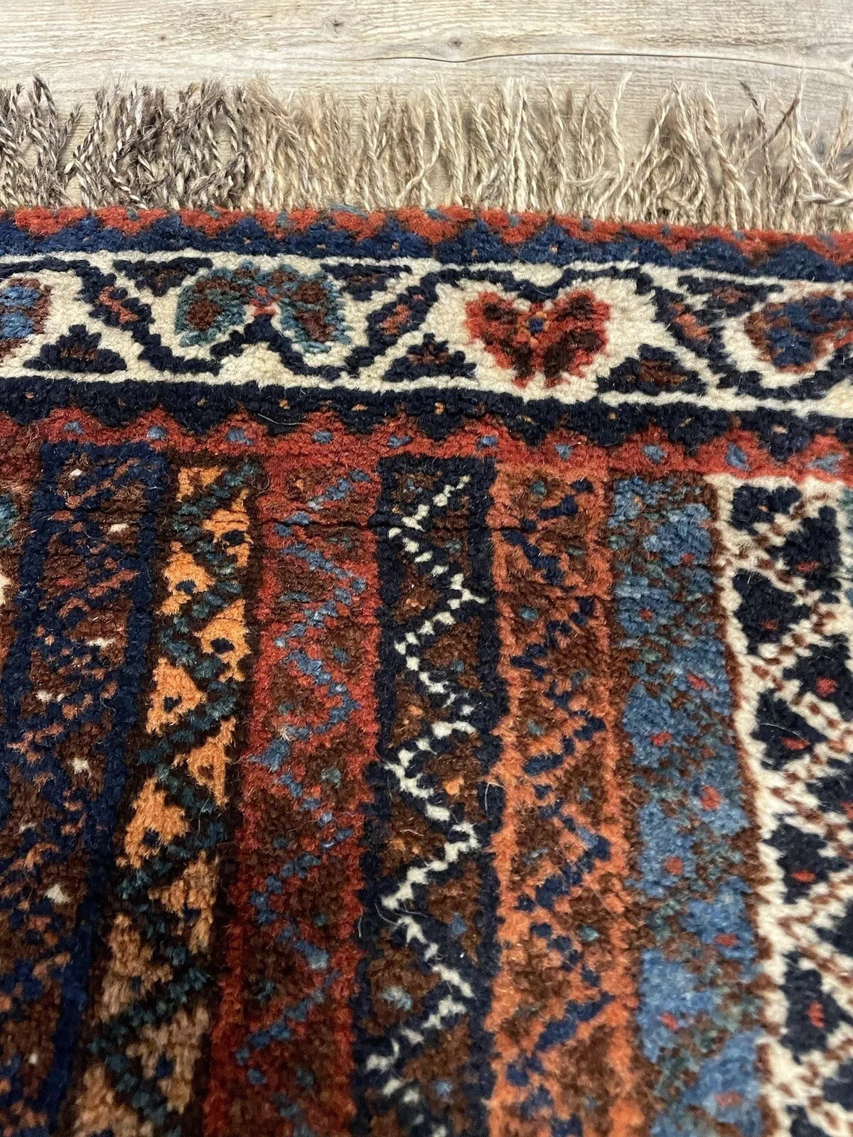 Vertical stripe design on an antique Persian Shiraz rug
