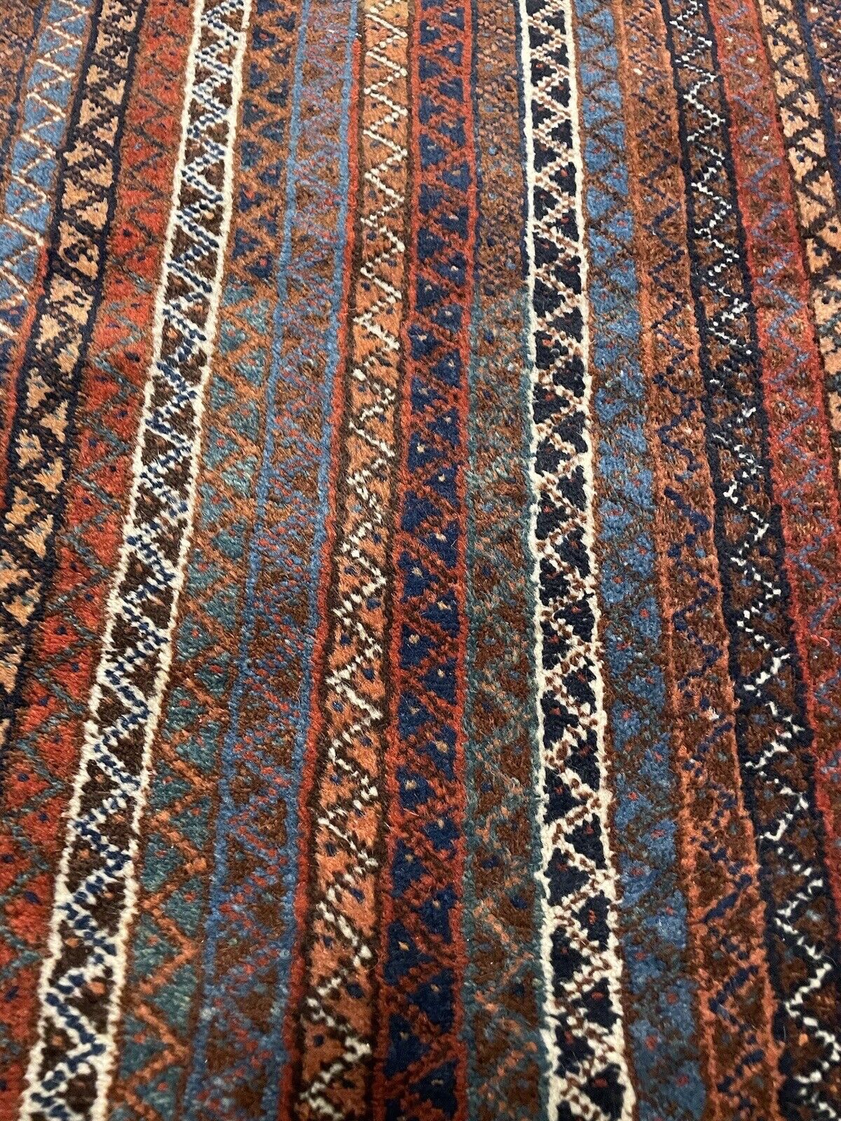 Tribal-style Persian Shiraz rug with bold stripe patterns
