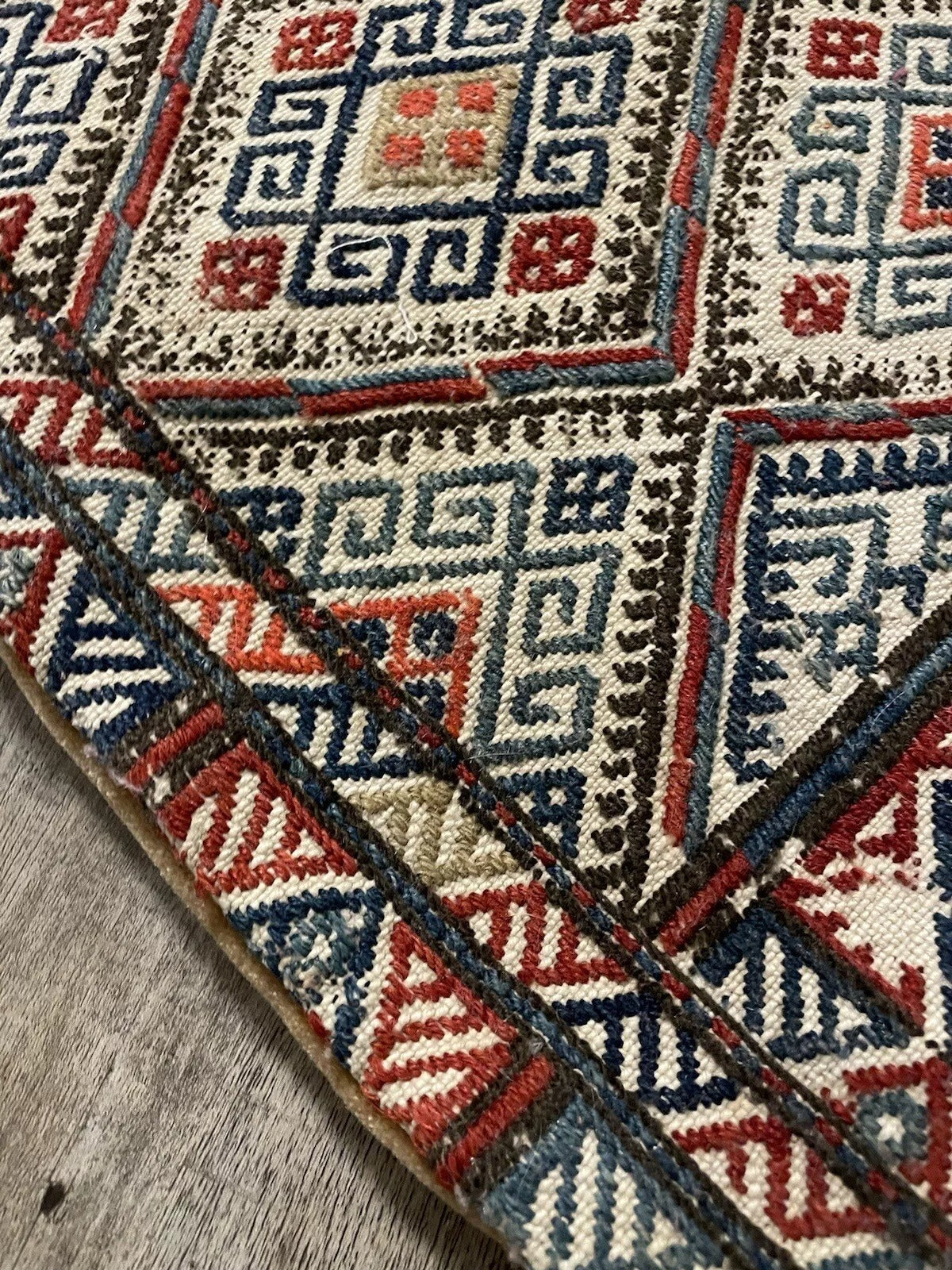Vintage Persian Sumak bag with traditional tribal patterns
