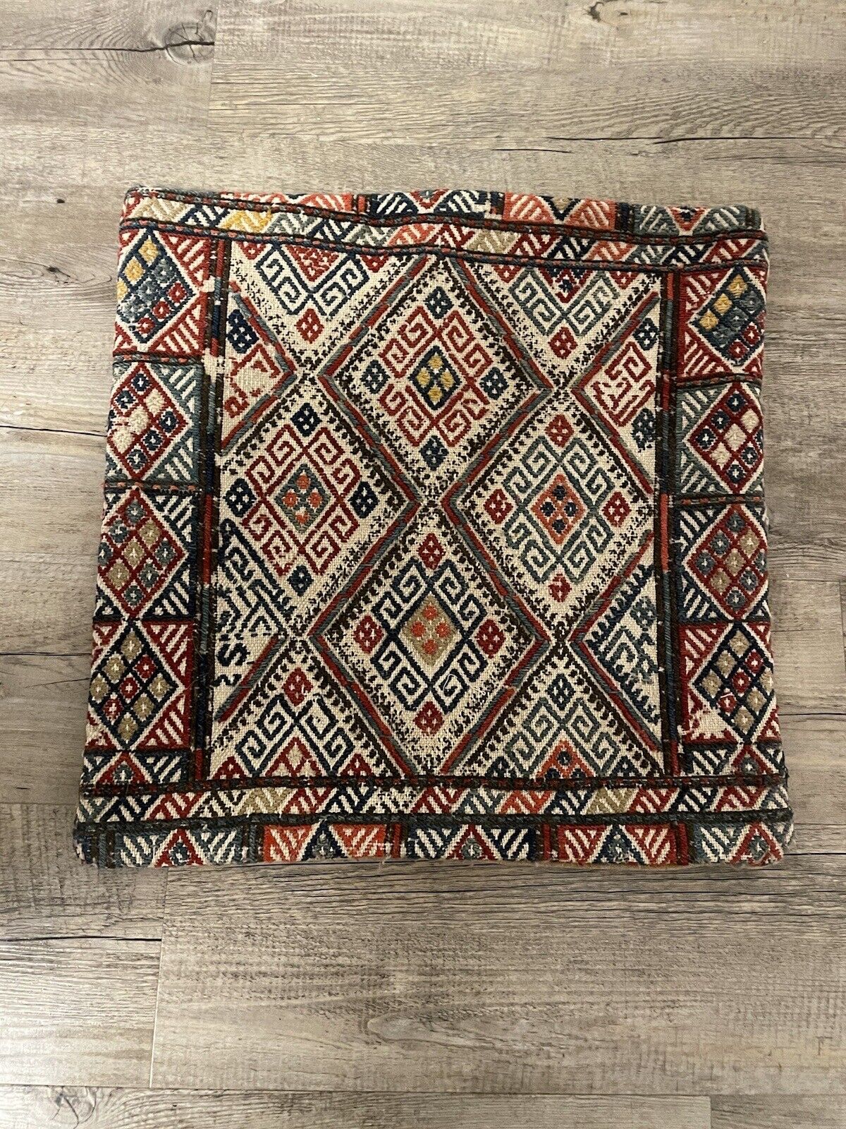 Detailed craftsmanship of a 1930s Persian Sumak bag

