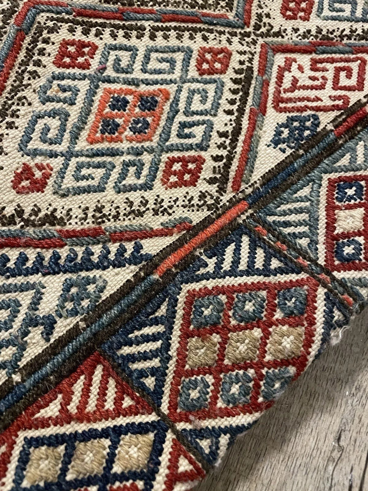 A Persian collectible bag with intricate woven patterns
