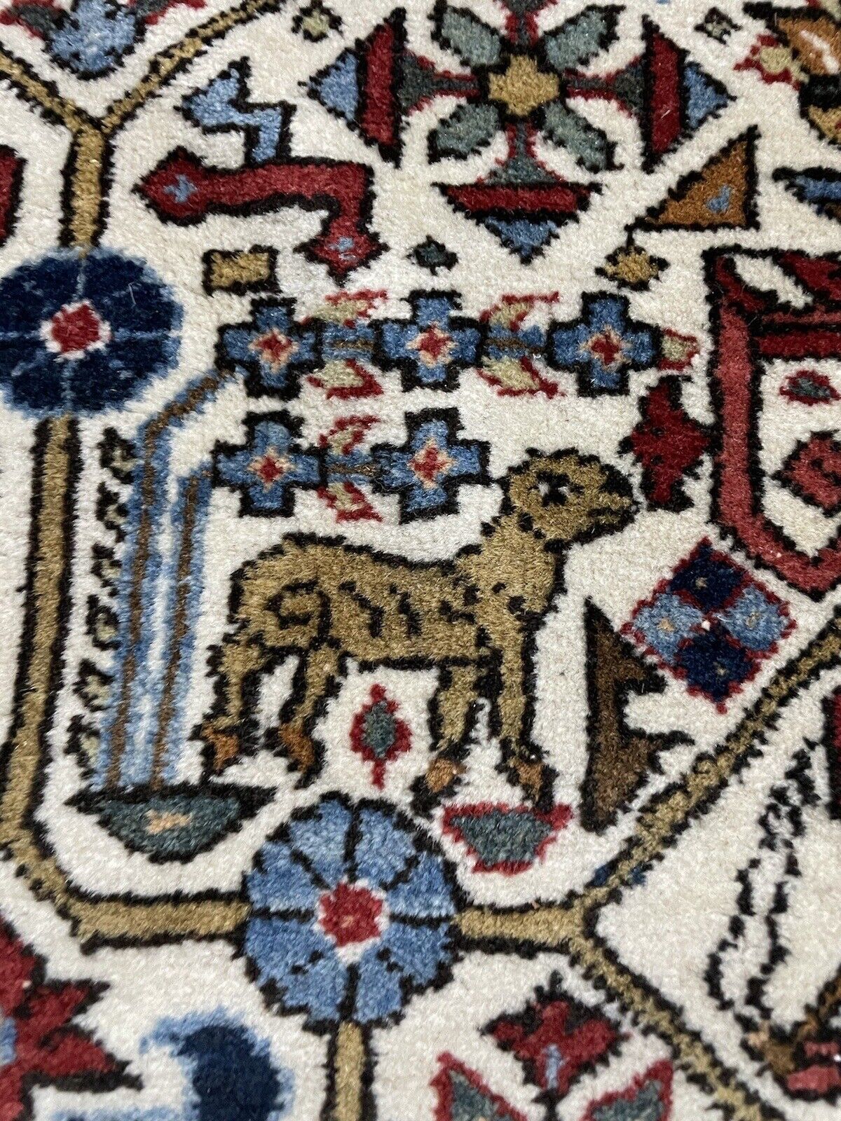 Hand-knotted Persian carpet with intricate vintage patterns
