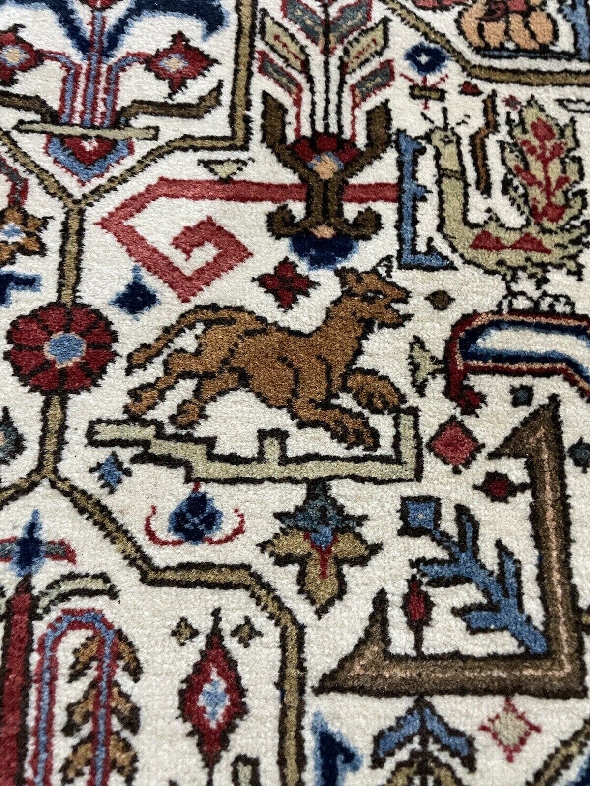 Large Persian Qum rug with intricate floral and geometric motifs
