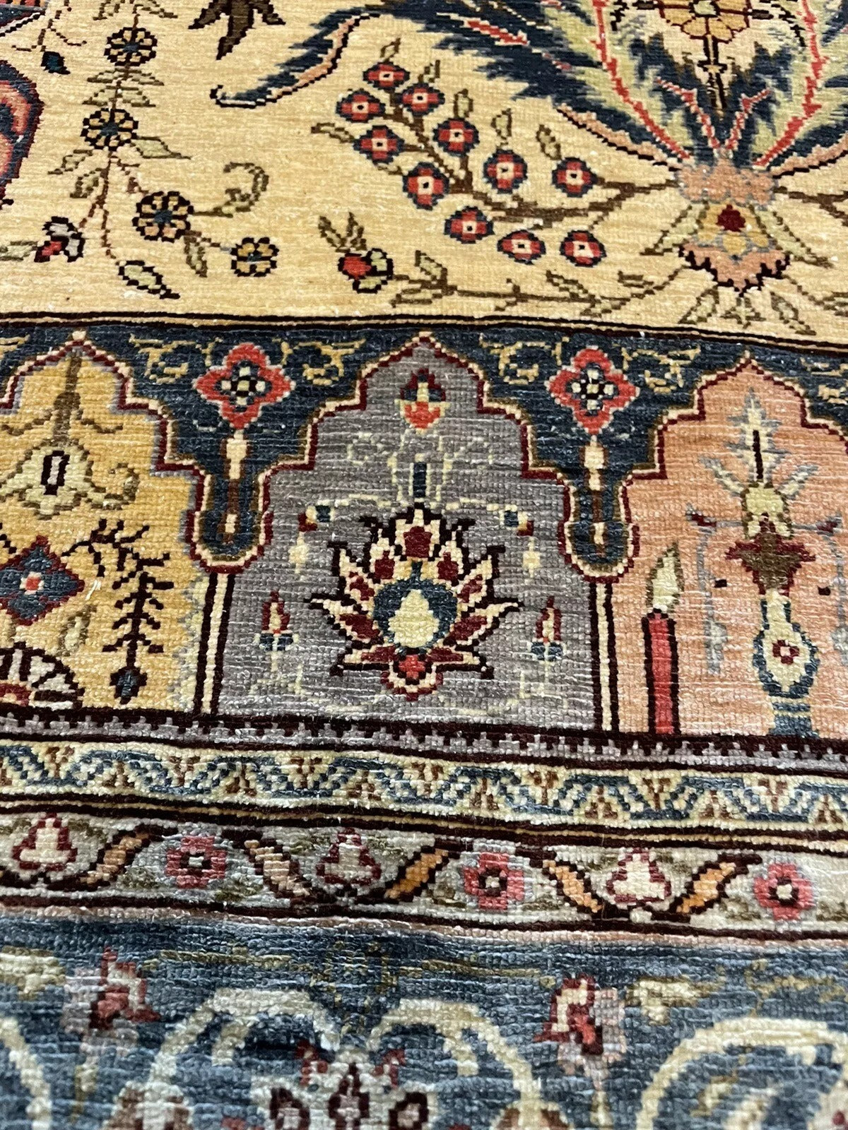 Exquisite floral medallion design on a vintage Hereke silk rug
