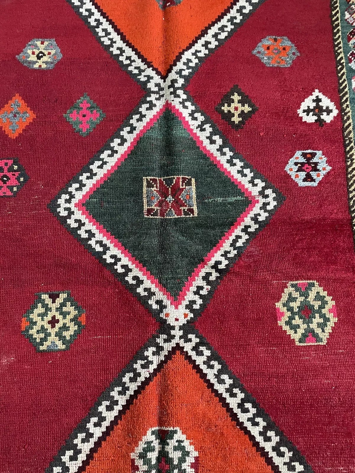 Close-up of hand-knotted Persian Gabbeh rug texture and design
