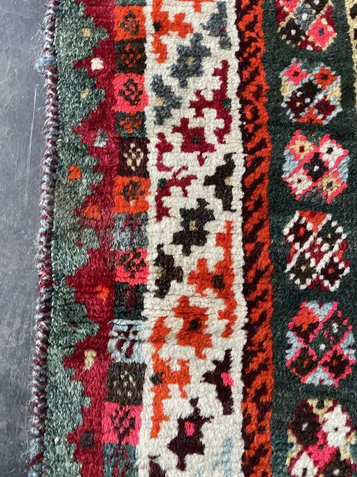 Tribal-style Persian Gabbeh wool rug with rich warm hues
