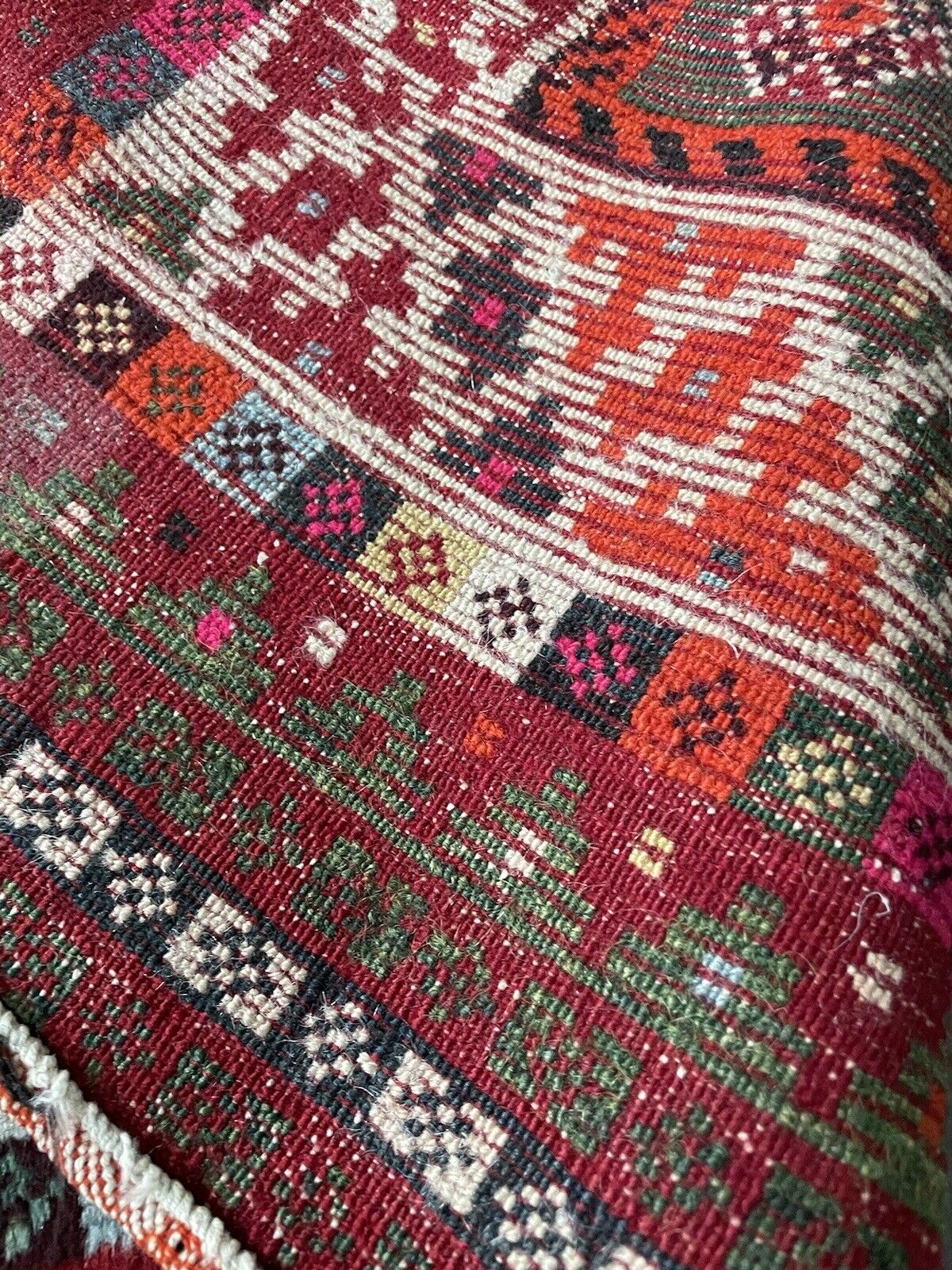 Handwoven vintage Persian rug with traditional nomadic design
