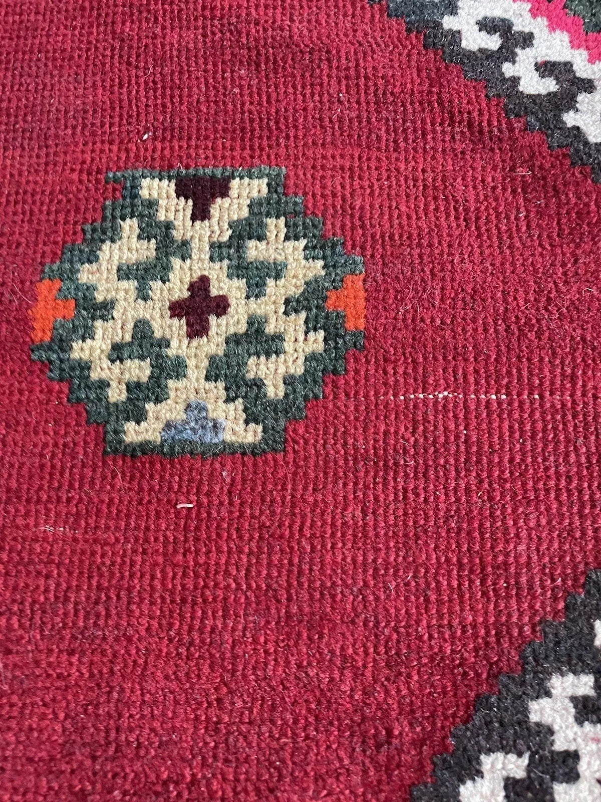 Traditional Persian hand-knotted Gabbeh rug with a warm color palette

