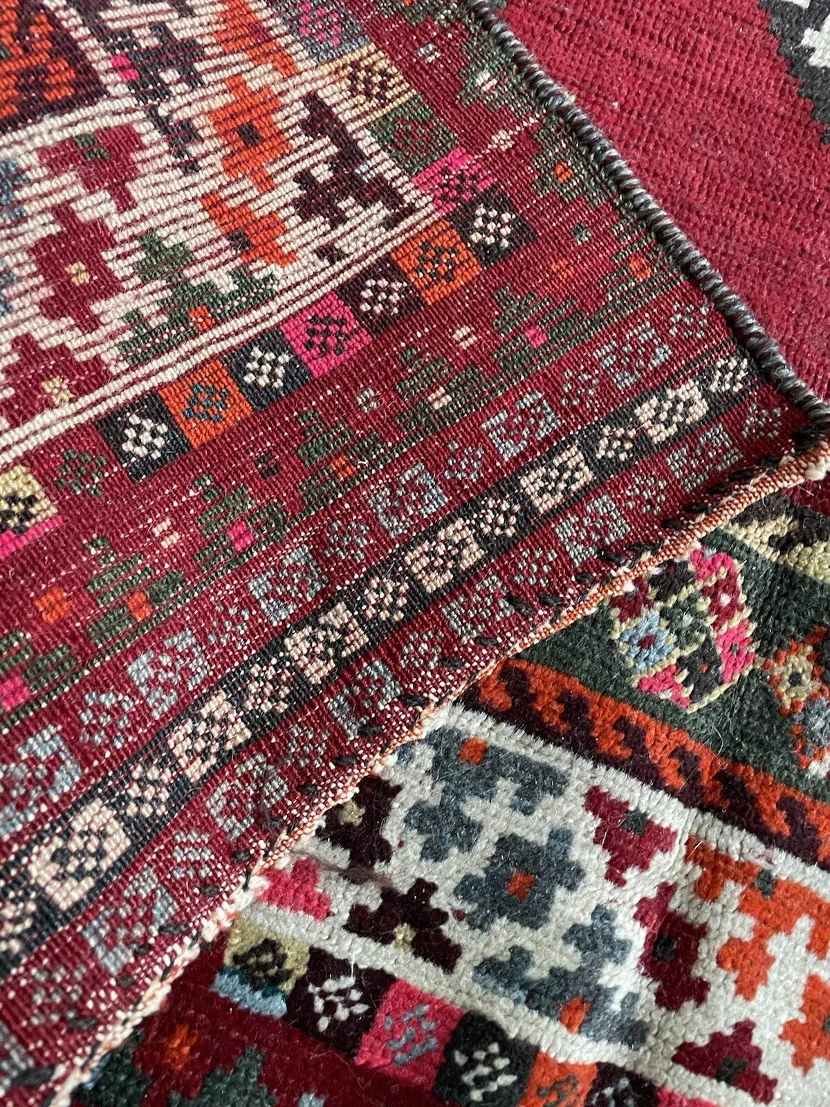 Rustic and vintage Persian wool rug with a bold geometric aesthetic
