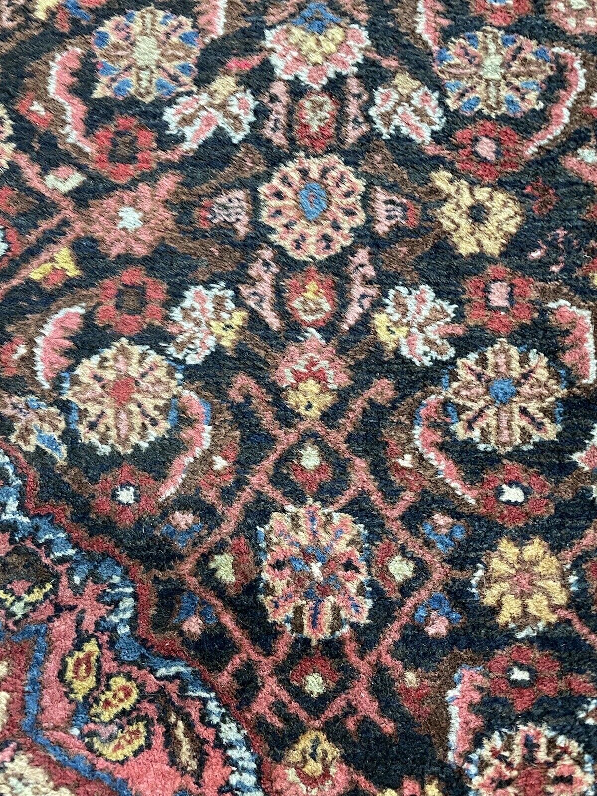 Traditional Persian Bidjar rug with dense knotting and rich colors
