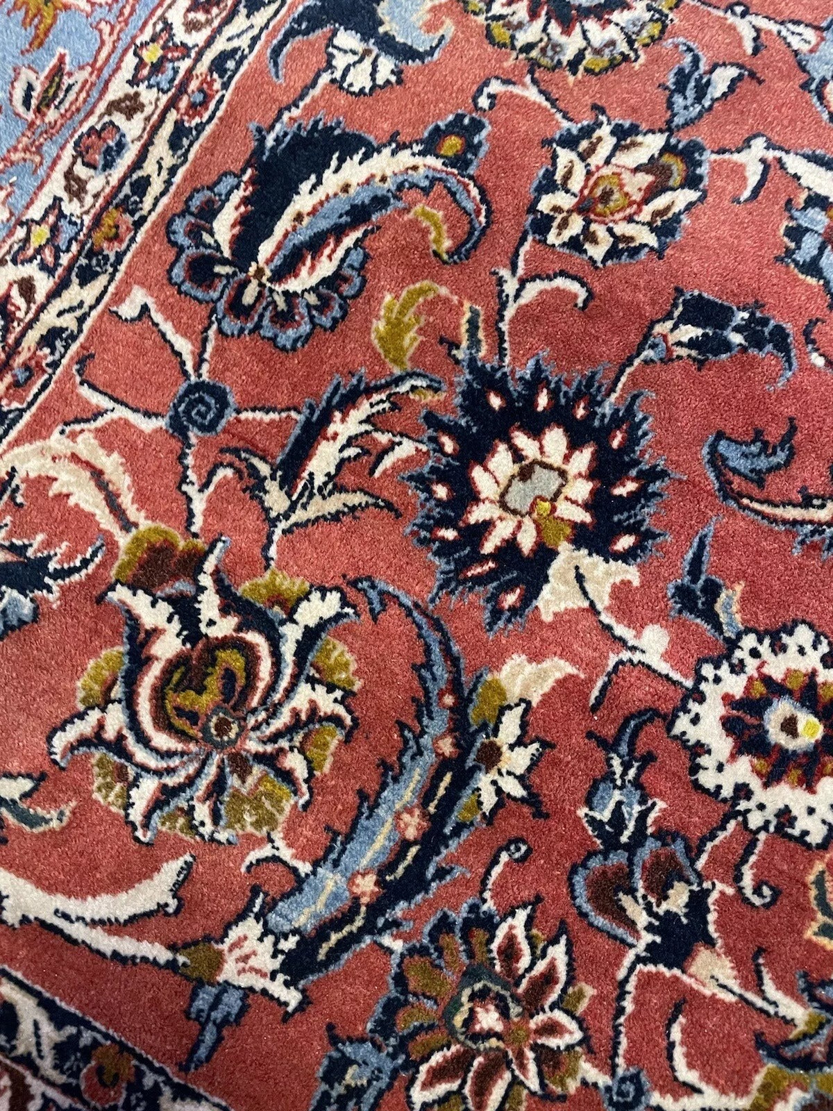 Detailed craftsmanship of a vintage Persian Tabriz rug
