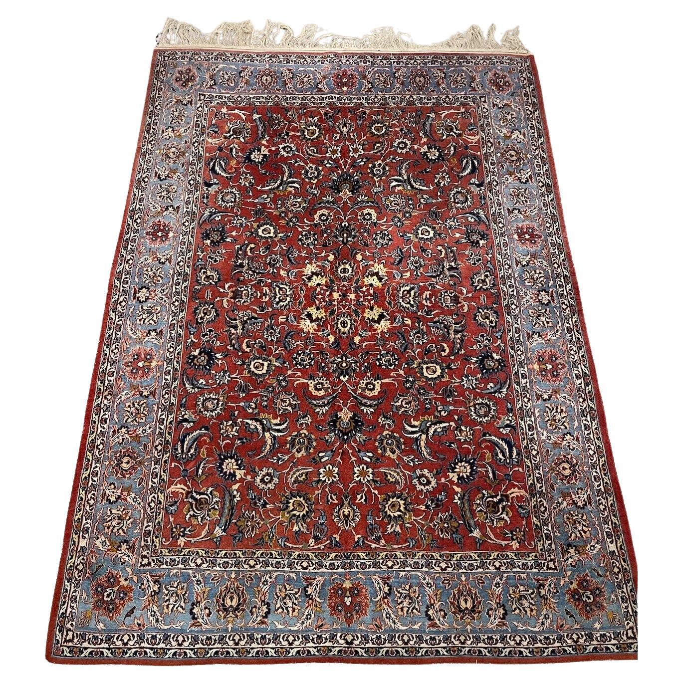 Handmade antique Persian Kashan rug from the 1920s
