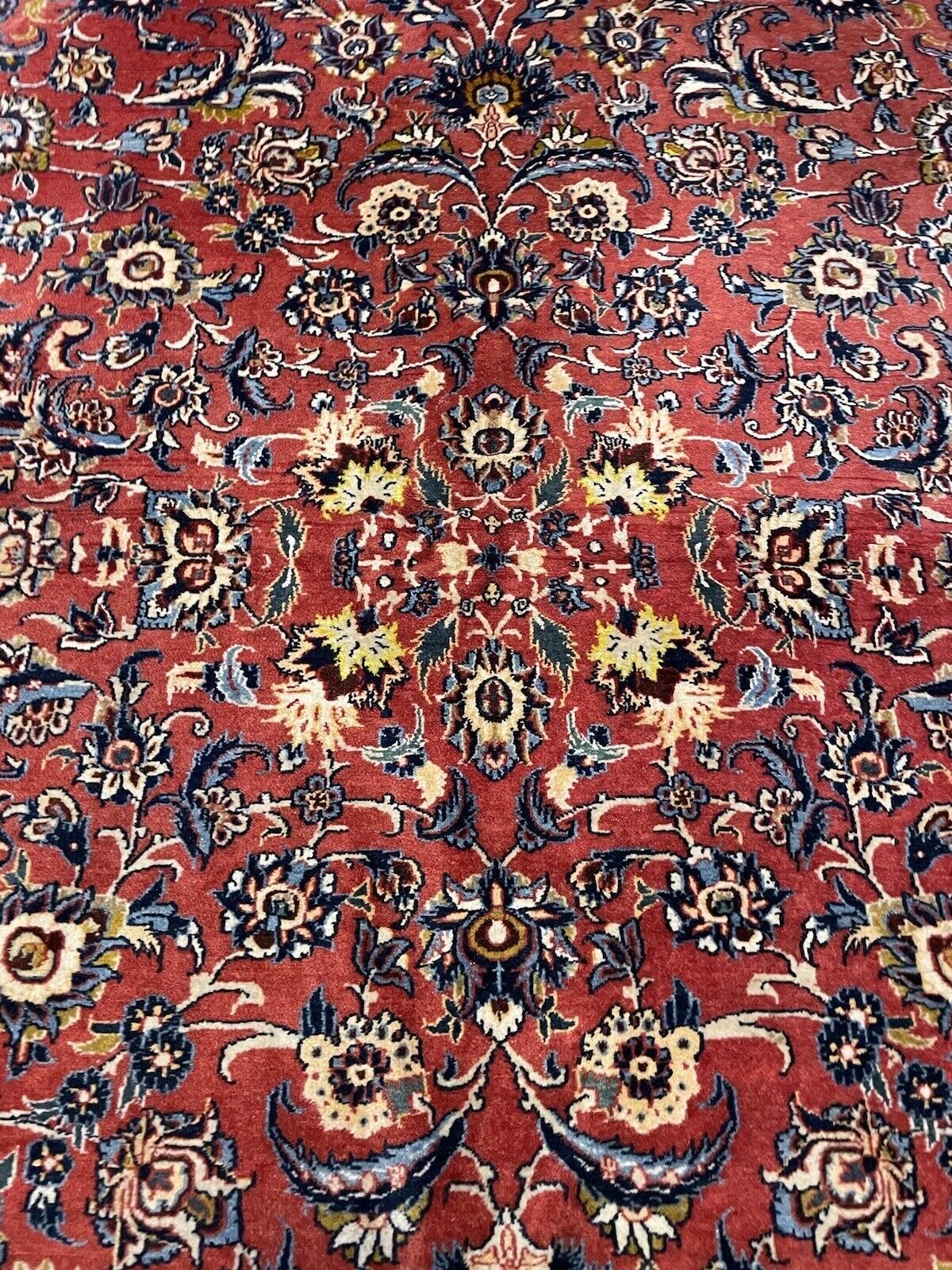 Persian wool rug with traditional Kashan motifs
