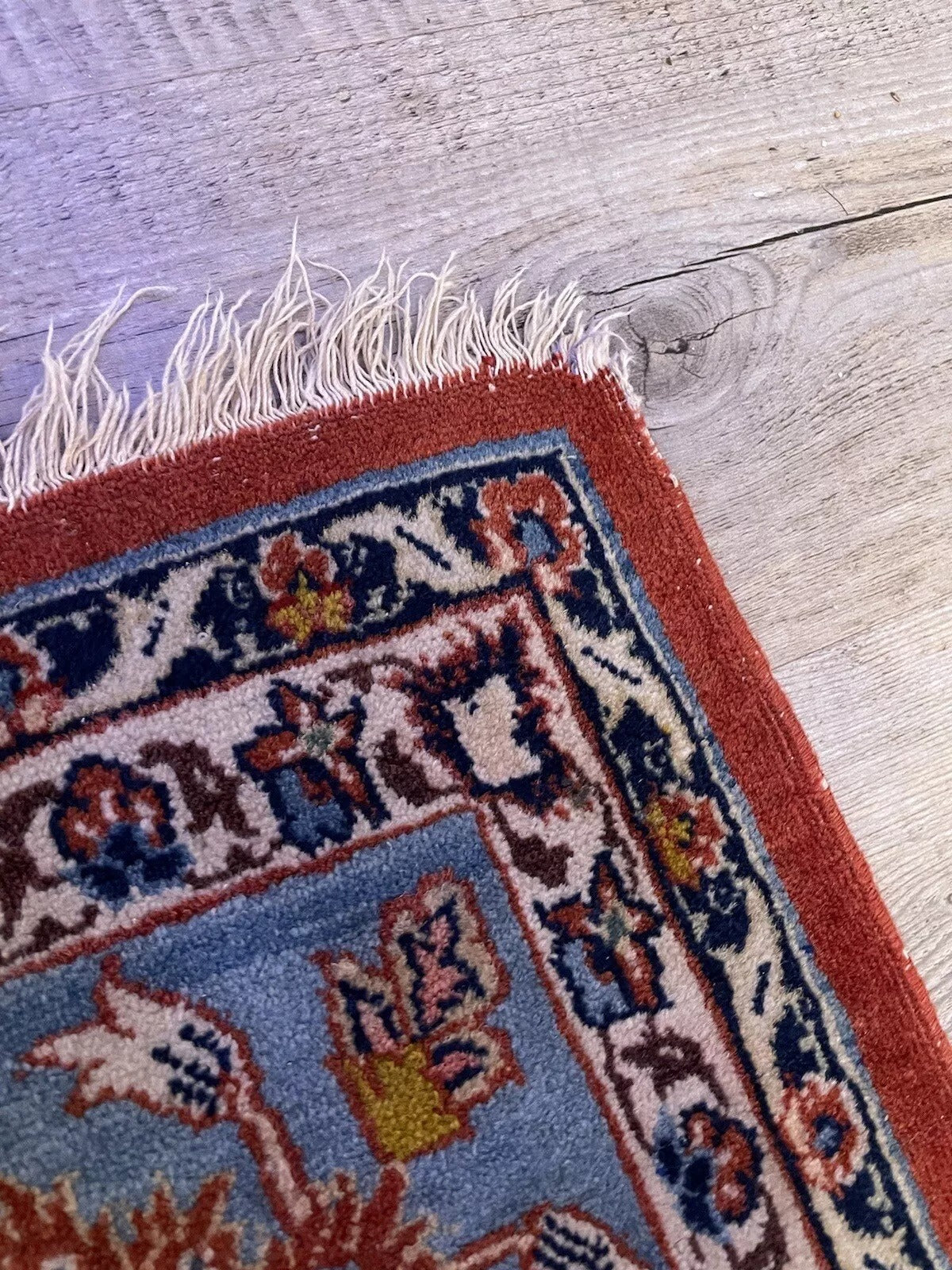 Vintage Persian Kashan rug with intricate floral patterns
