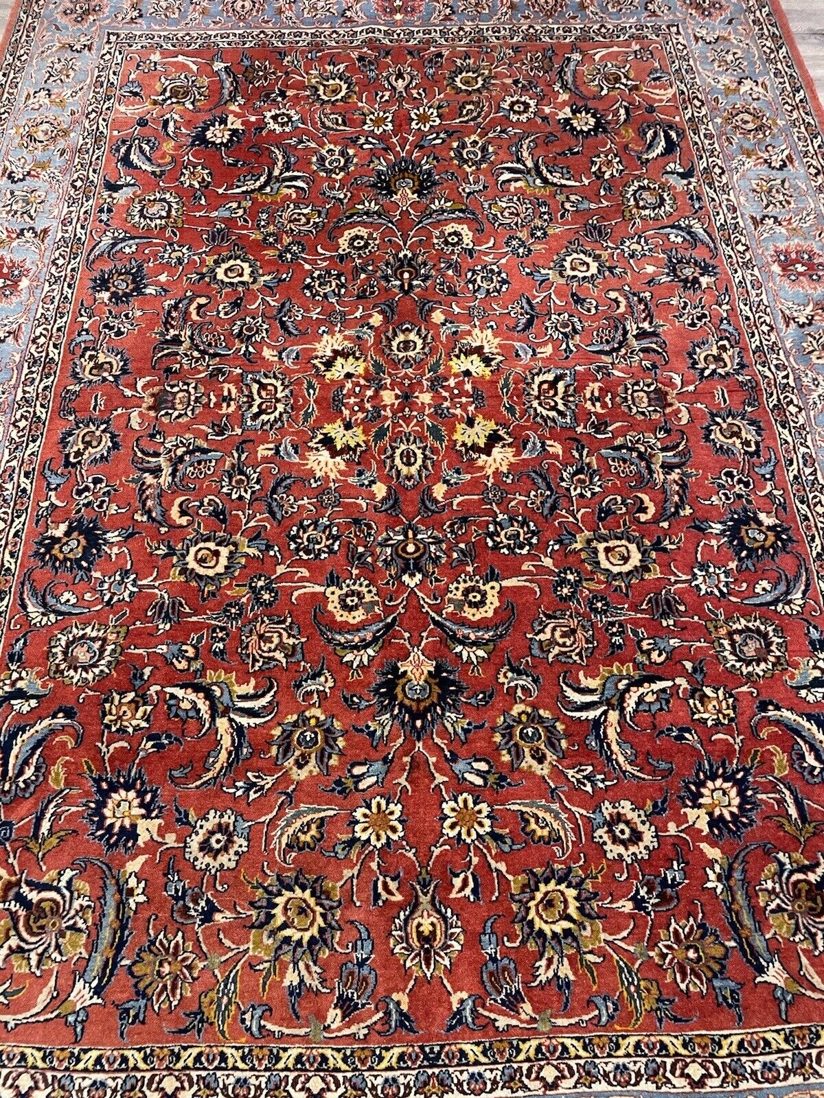 Handmade antique Kashan rug with floral medallions
