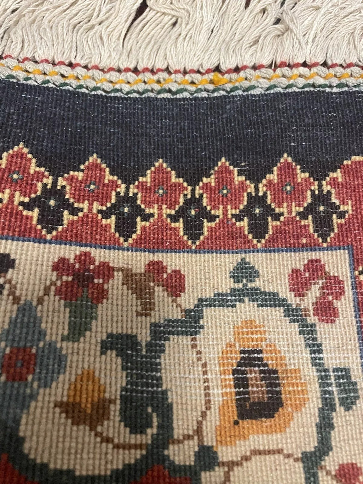 Close-up of intricate motifs on a vintage Tabriz rug
