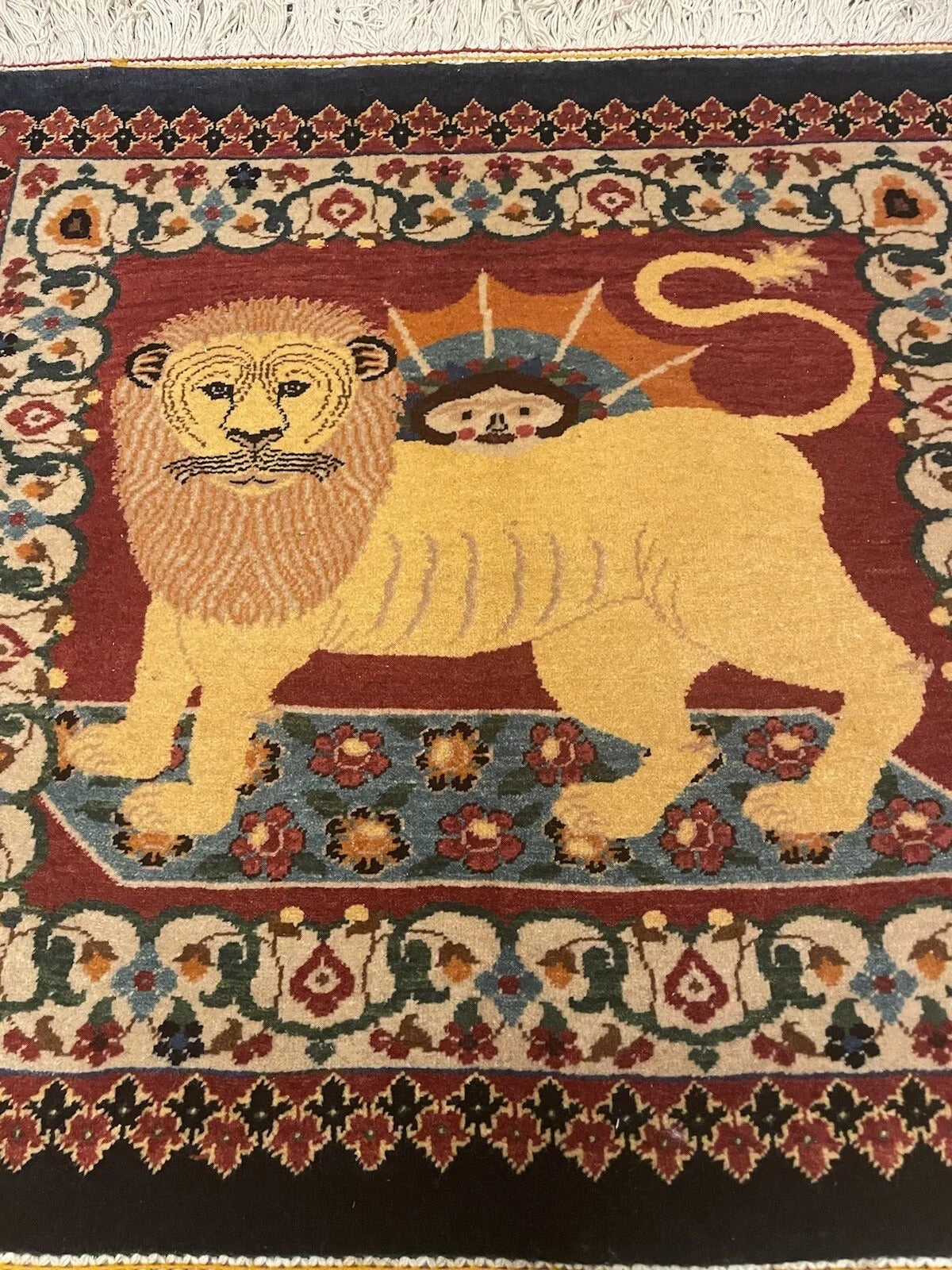 Detailed view of a vintage Persian Tabriz rug's patterns
