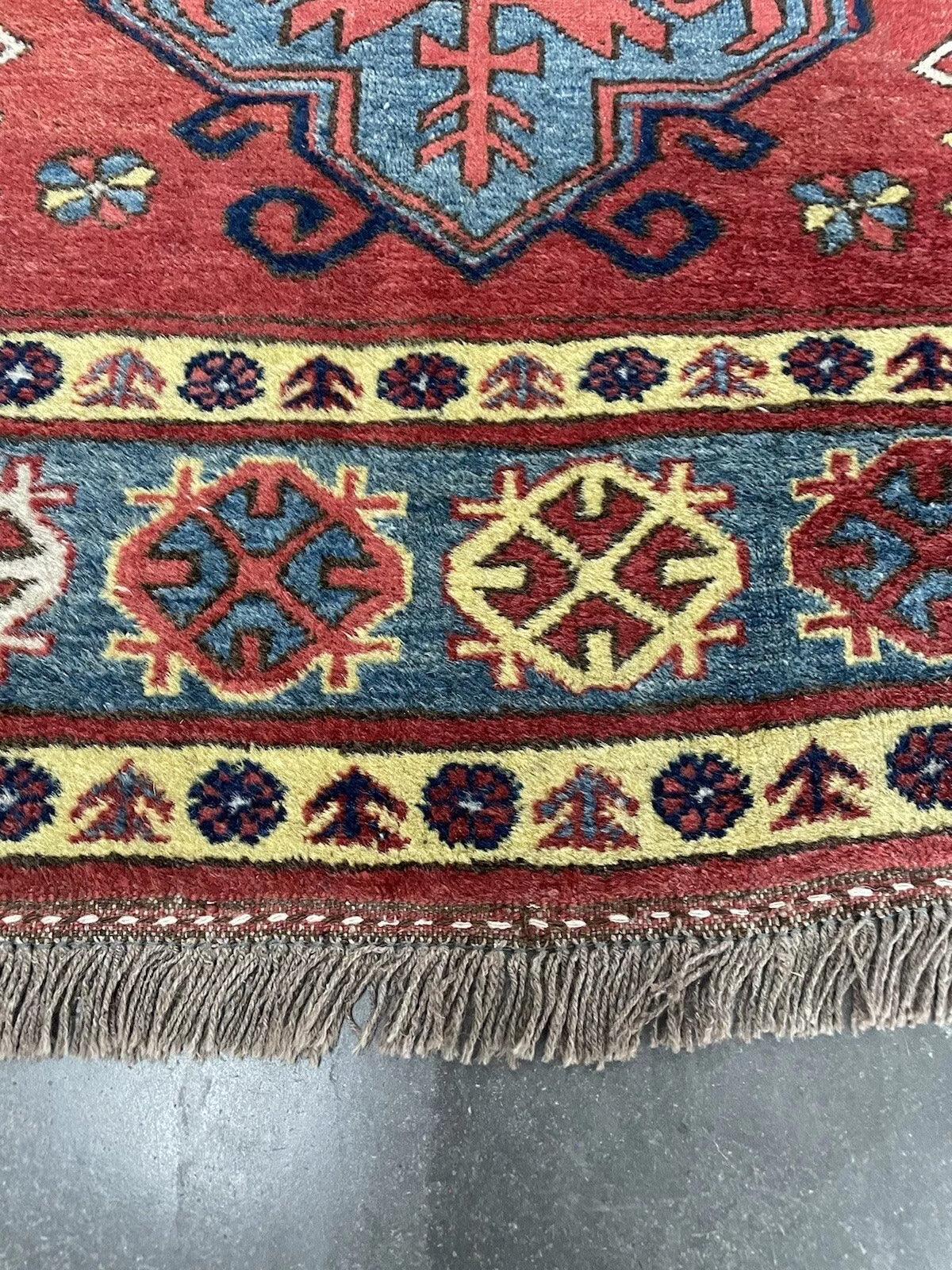 Handmade vintage wool rug — bold Kazak tribal style
