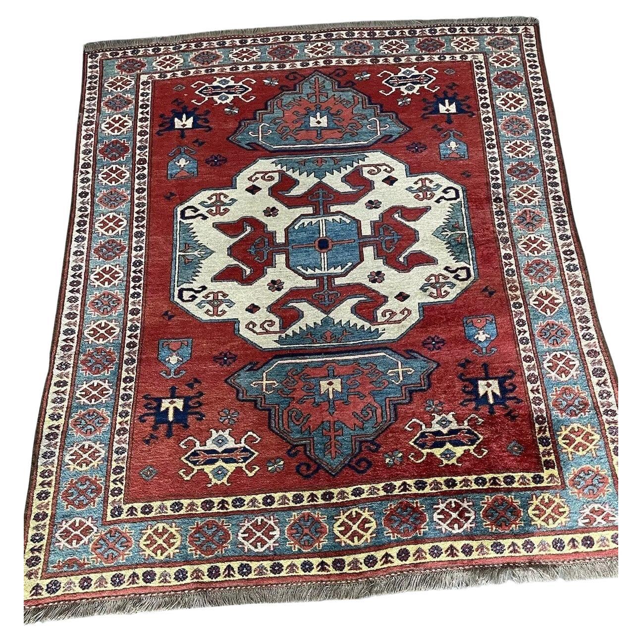 Handmade vintage Caucasian Kazak rug from the 1970s
