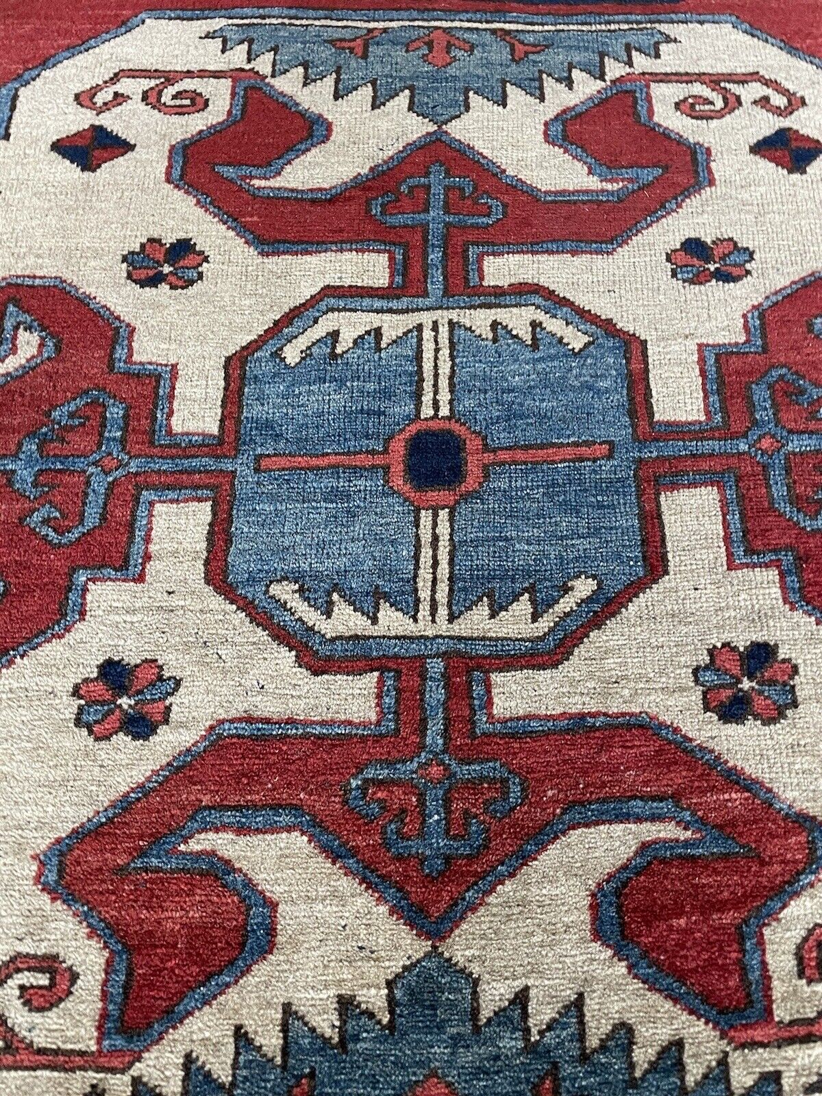 Woolen vintage Kazak rug with traditional Caucasian patterns
