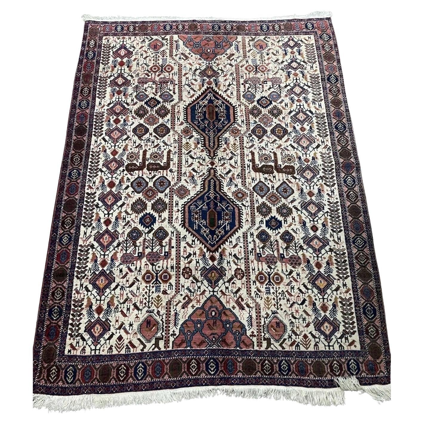 Close-up of intricate geometric patterns on a vintage Persian Afshar rug
