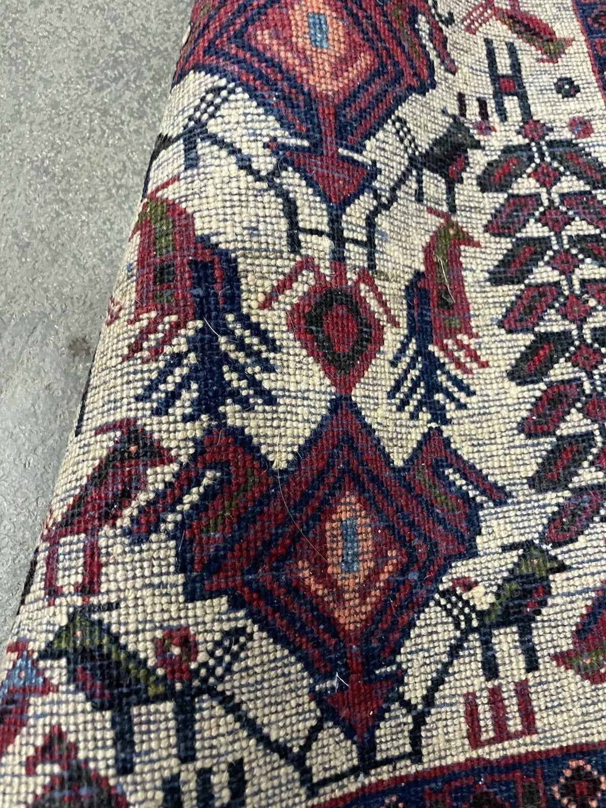 Vintage wool Persian Afshar rug with cultural significance
