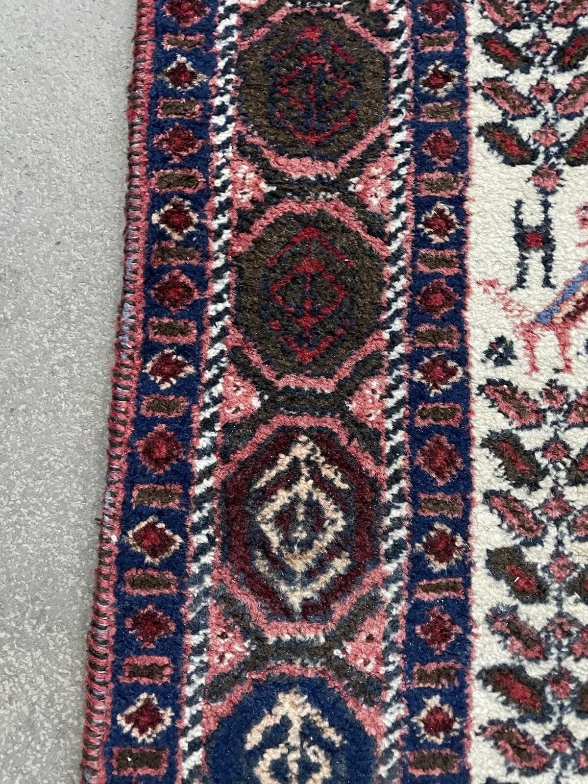 Detailed corner design of a vintage Afshar rug
