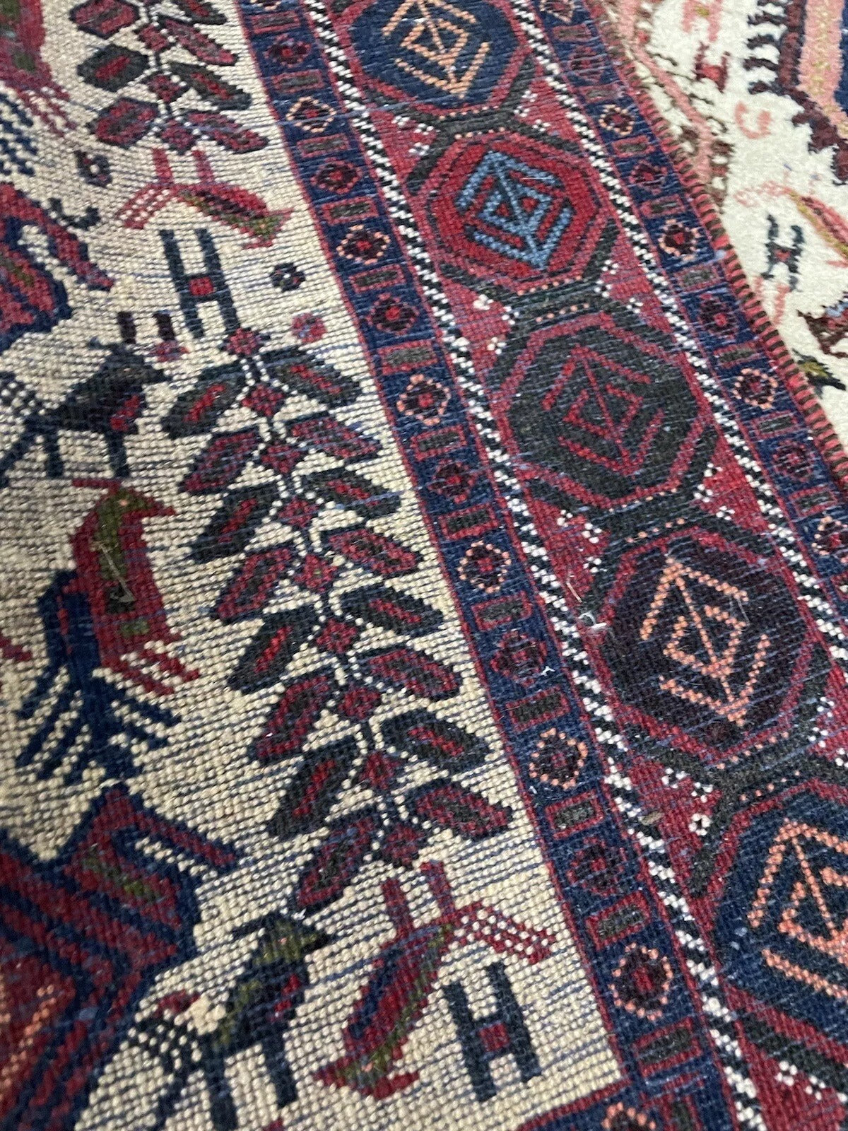 Rich, earthy colors on a handmade Persian Afshar wool rug
