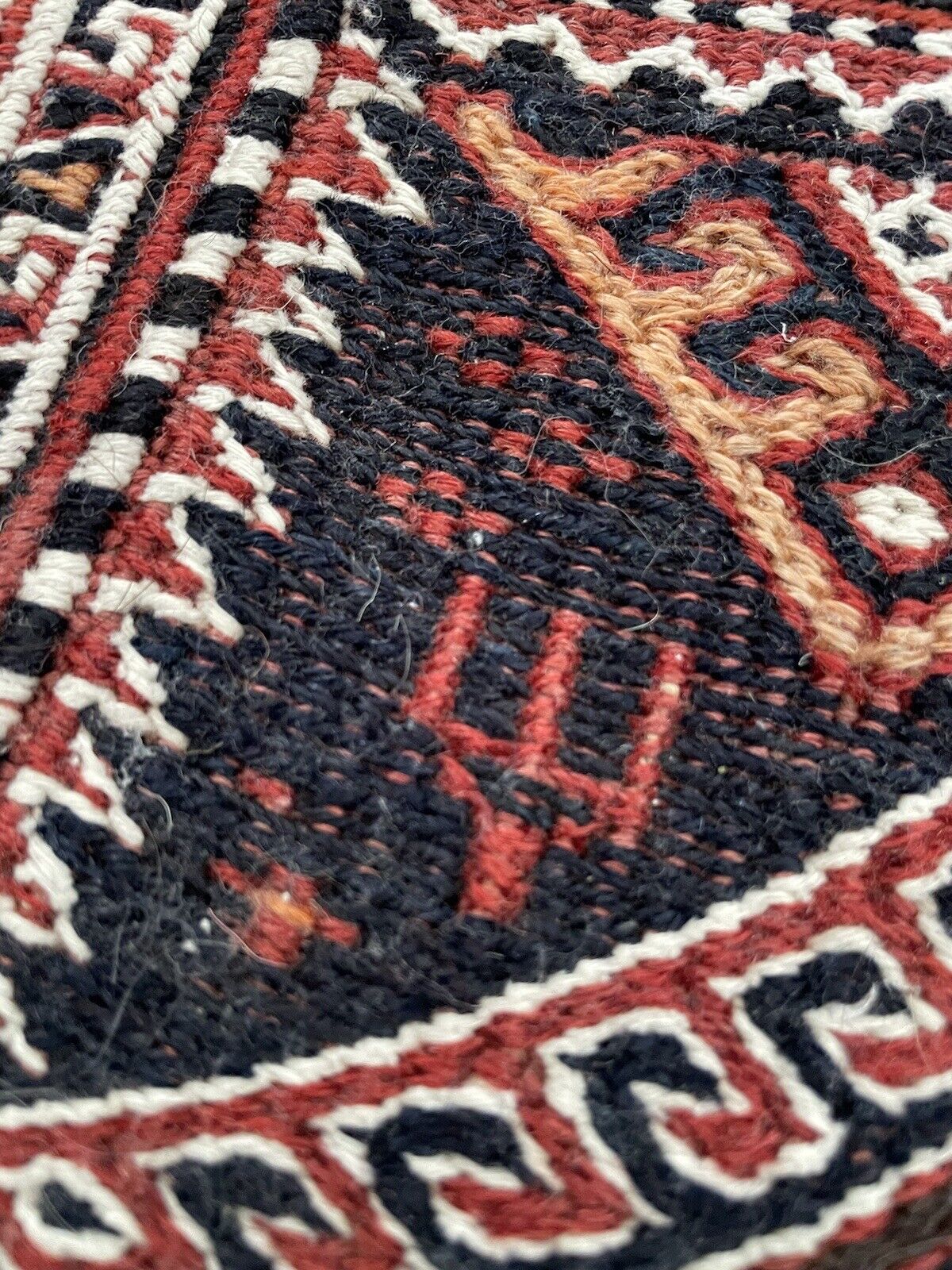 Full view of a vintage Persian Sumak salt bag with red, black, and white colors
