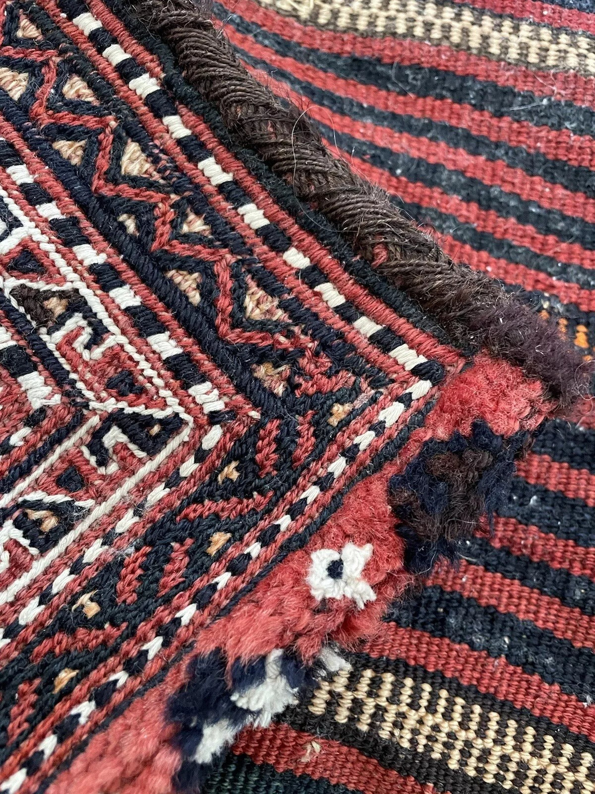 Detailed weaving of a Persian Sumak salt bag, circa 1900s
