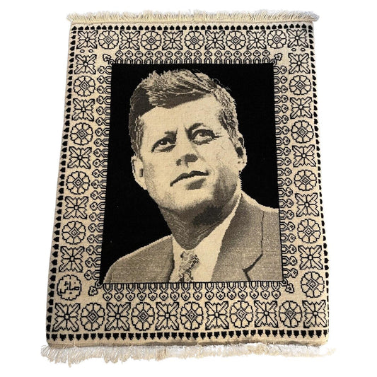 Close-up of John F. Kennedy portrait on a vintage Tabriz rug
