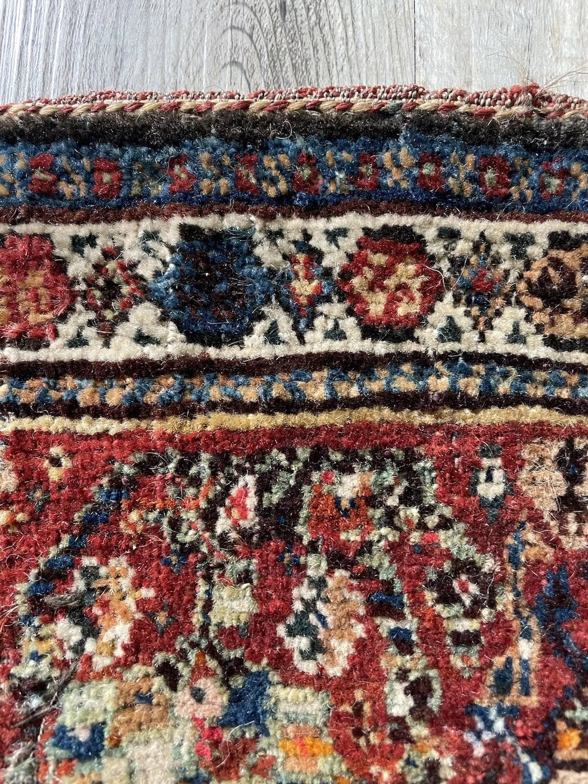 Unique antique wool rug from the Gashkai weaving tradition
