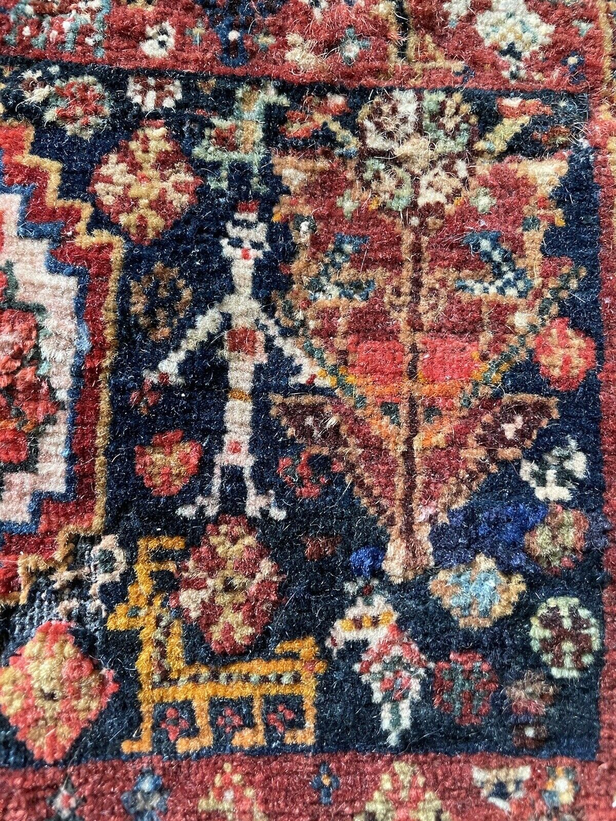 Hand-knotted vintage Gashkai rug with geometric and floral patterns
