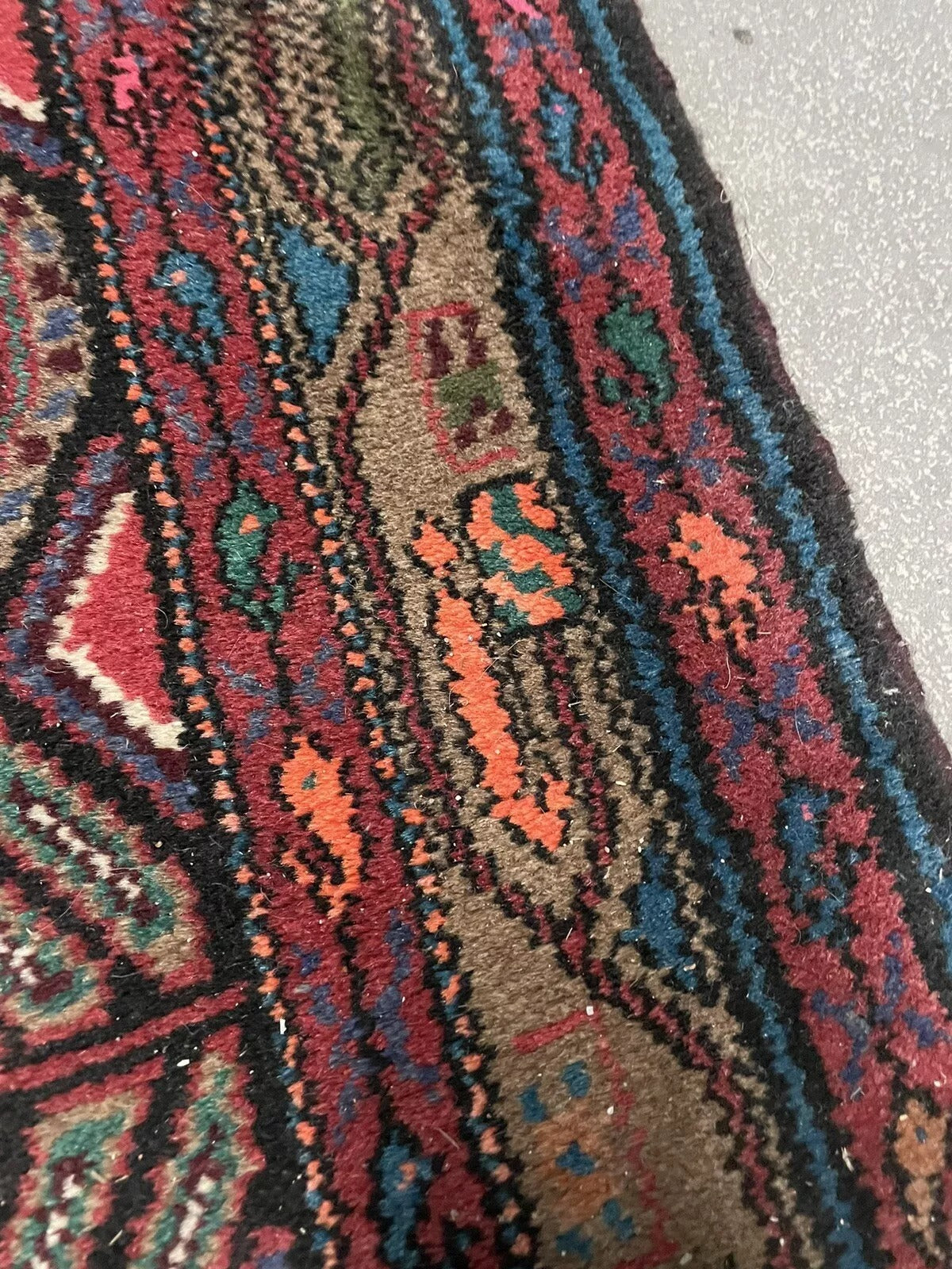 Vibrant red and blue accents on a vintage Hamadan wool runner
