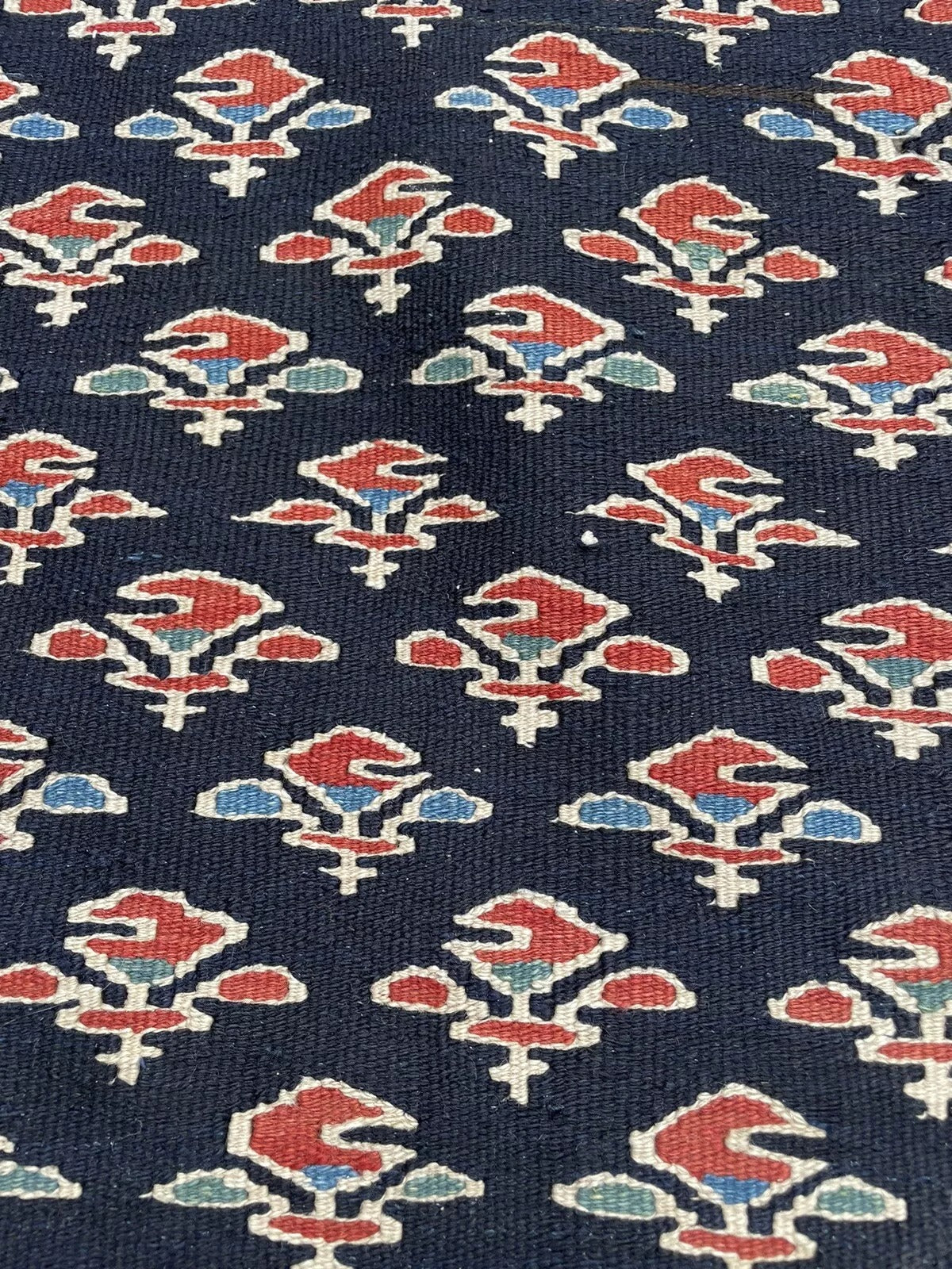Hand-knotted Gashkai wool rug with intricate geometric design

