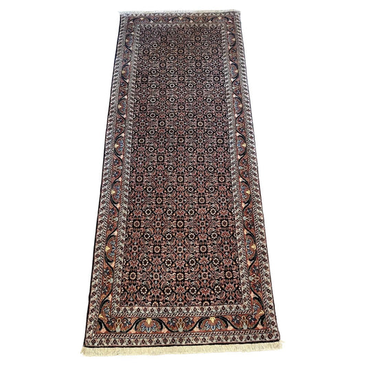 Handmade vintage Bidjar rug with intricate floral and geometric patterns

