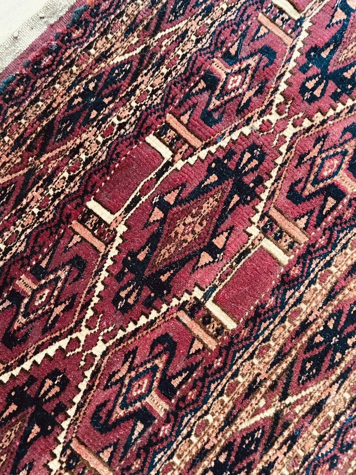 Handmade wool rug with geometric tribal motifs from the Yomud tribe
