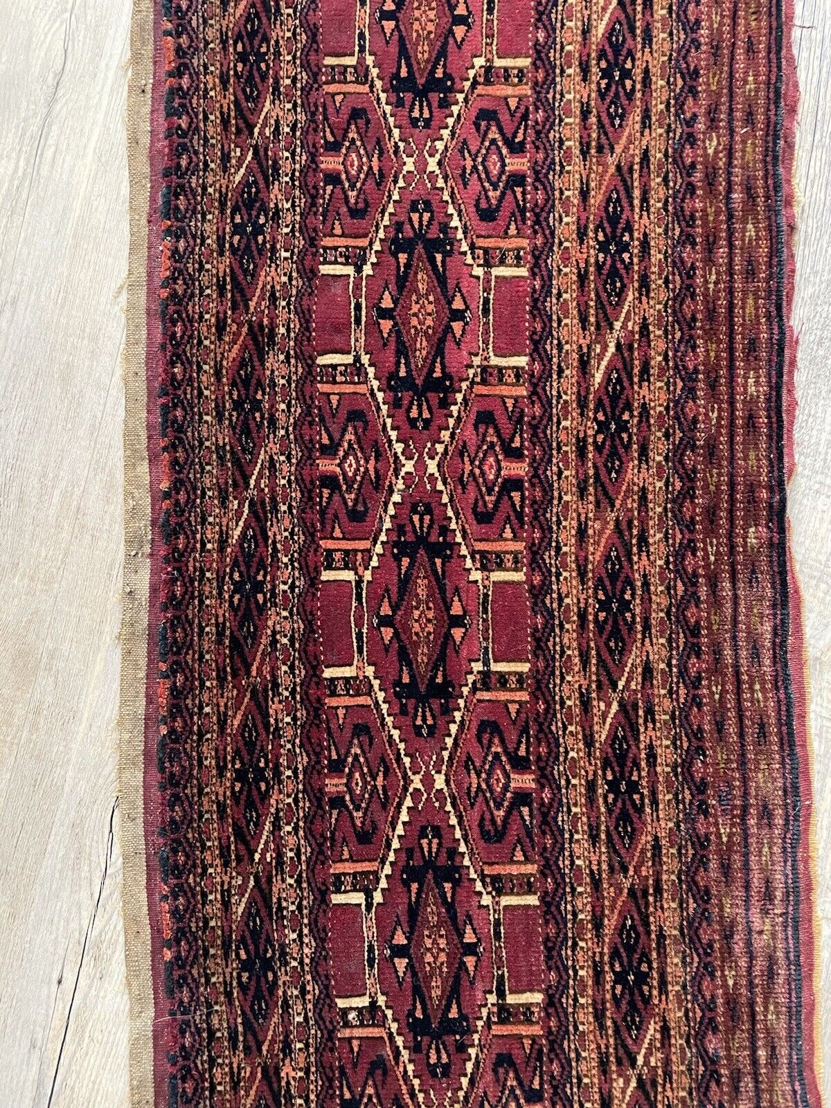 Traditional handwoven knots in a vintage Yomud wool rug
