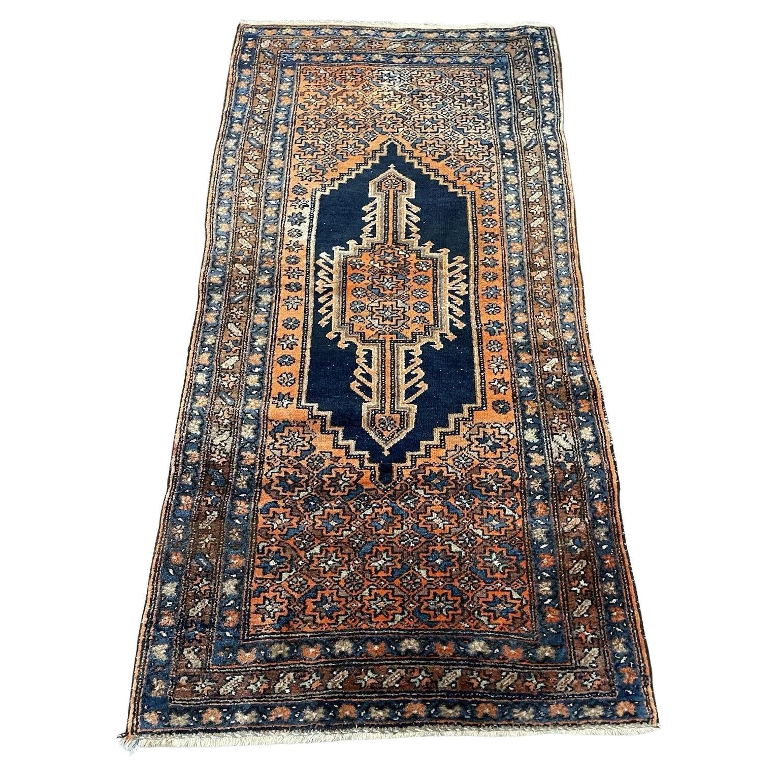 Handmade antique Persian Hamadan rug featuring intricate floral patterns
