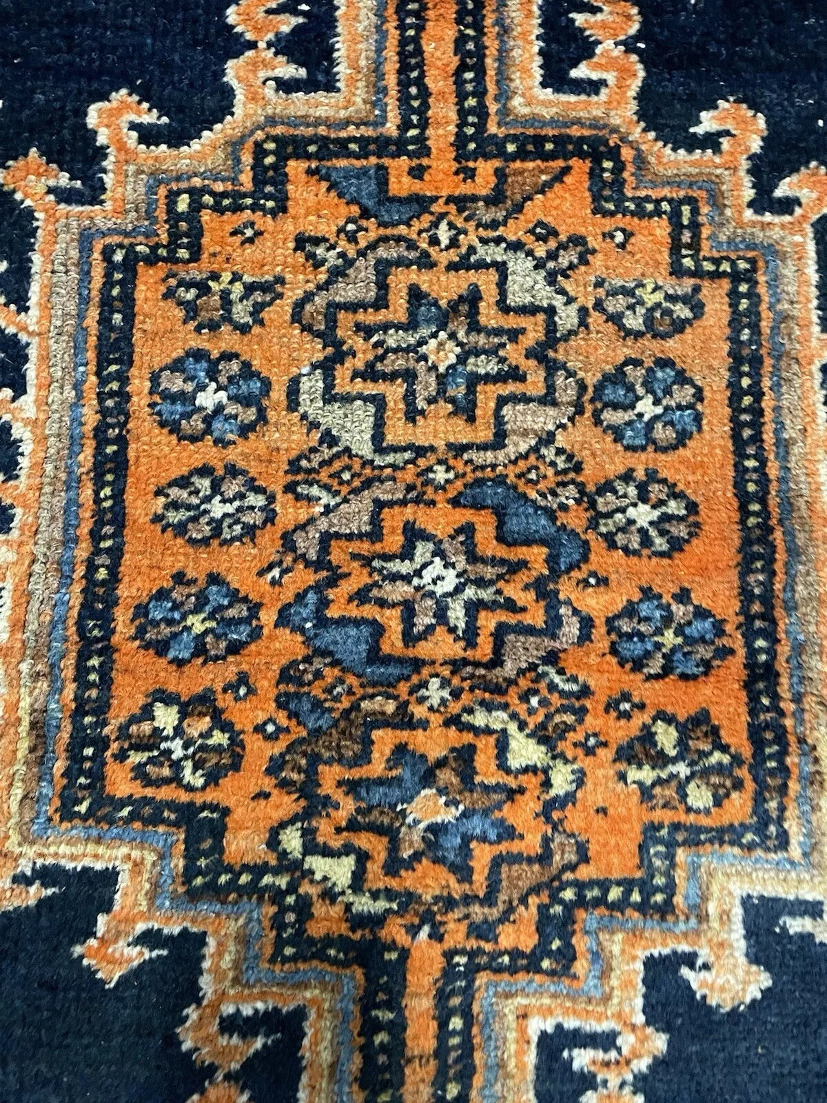 Antique hand-knotted Persian rug with exquisite craftsmanship
