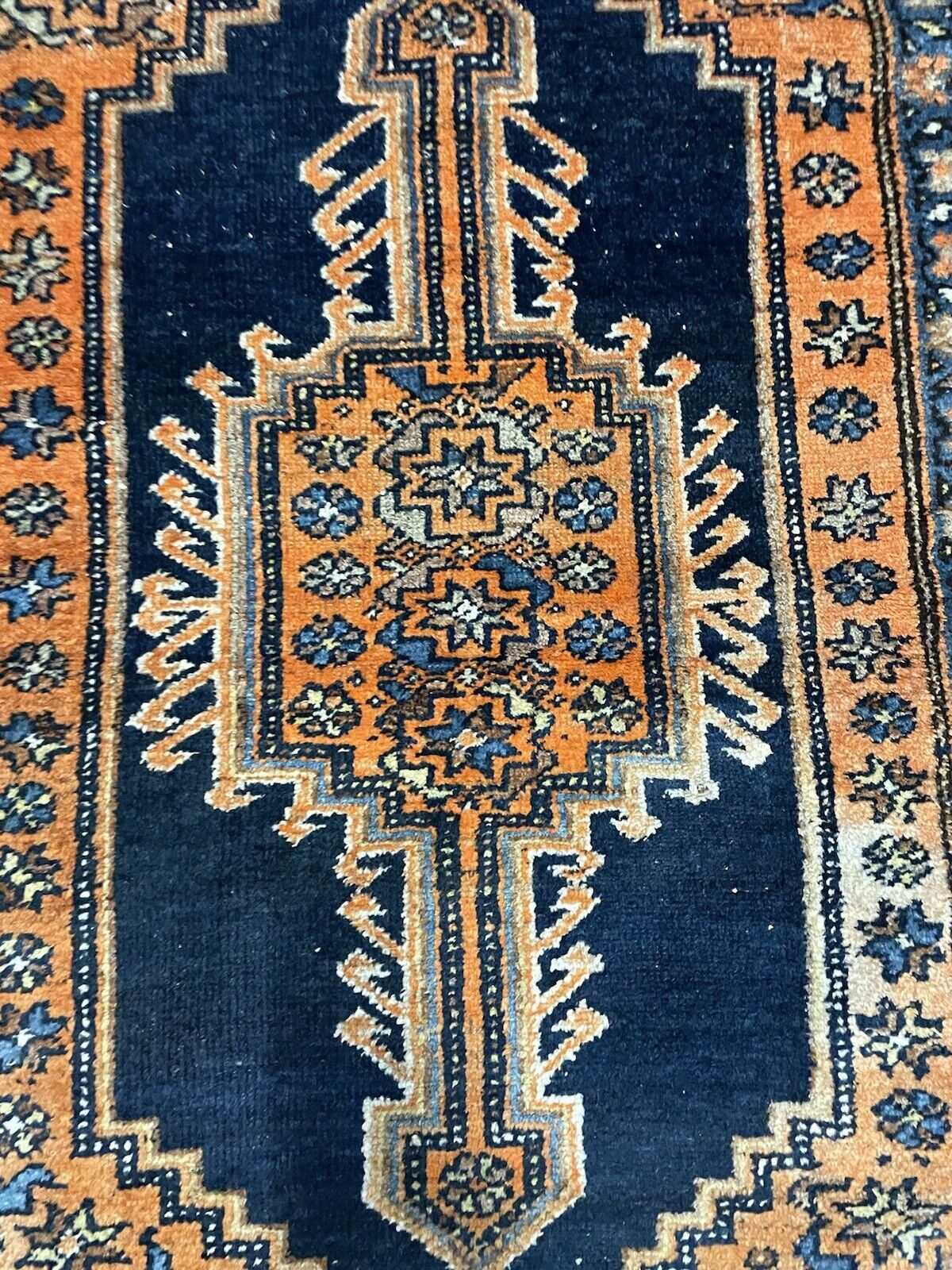 Soft wool texture and detailed weaving of a vintage Persian carpet
