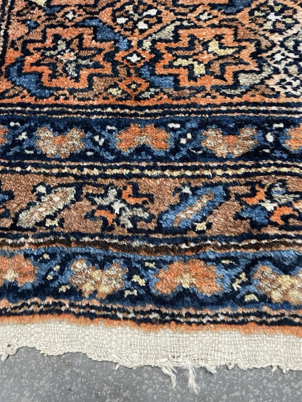 Traditional Persian rug showcasing a symmetrical medallion pattern
