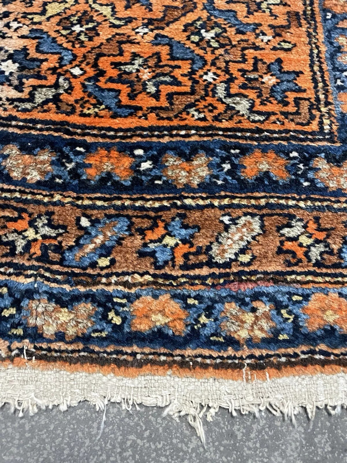 Antique Persian wool rug with timeless geometric elegance

