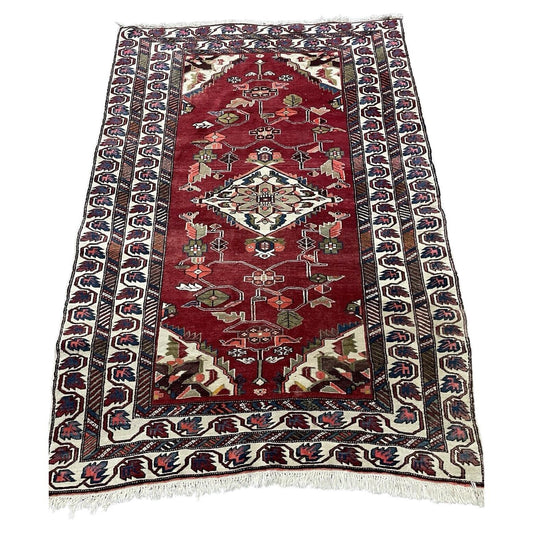 Handmade vintage Persian Hamadan rug with red field and floral motifs.

