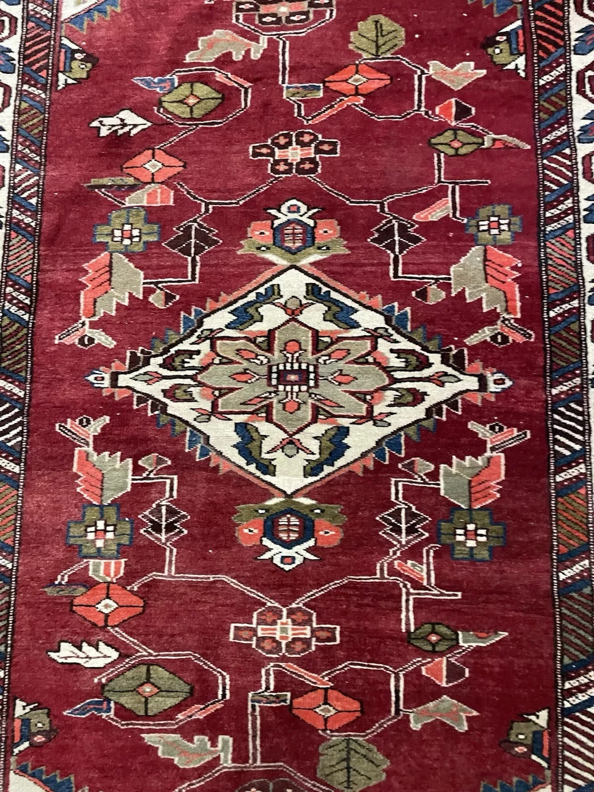 Central medallion of the vintage Persian Hamadan rug.

