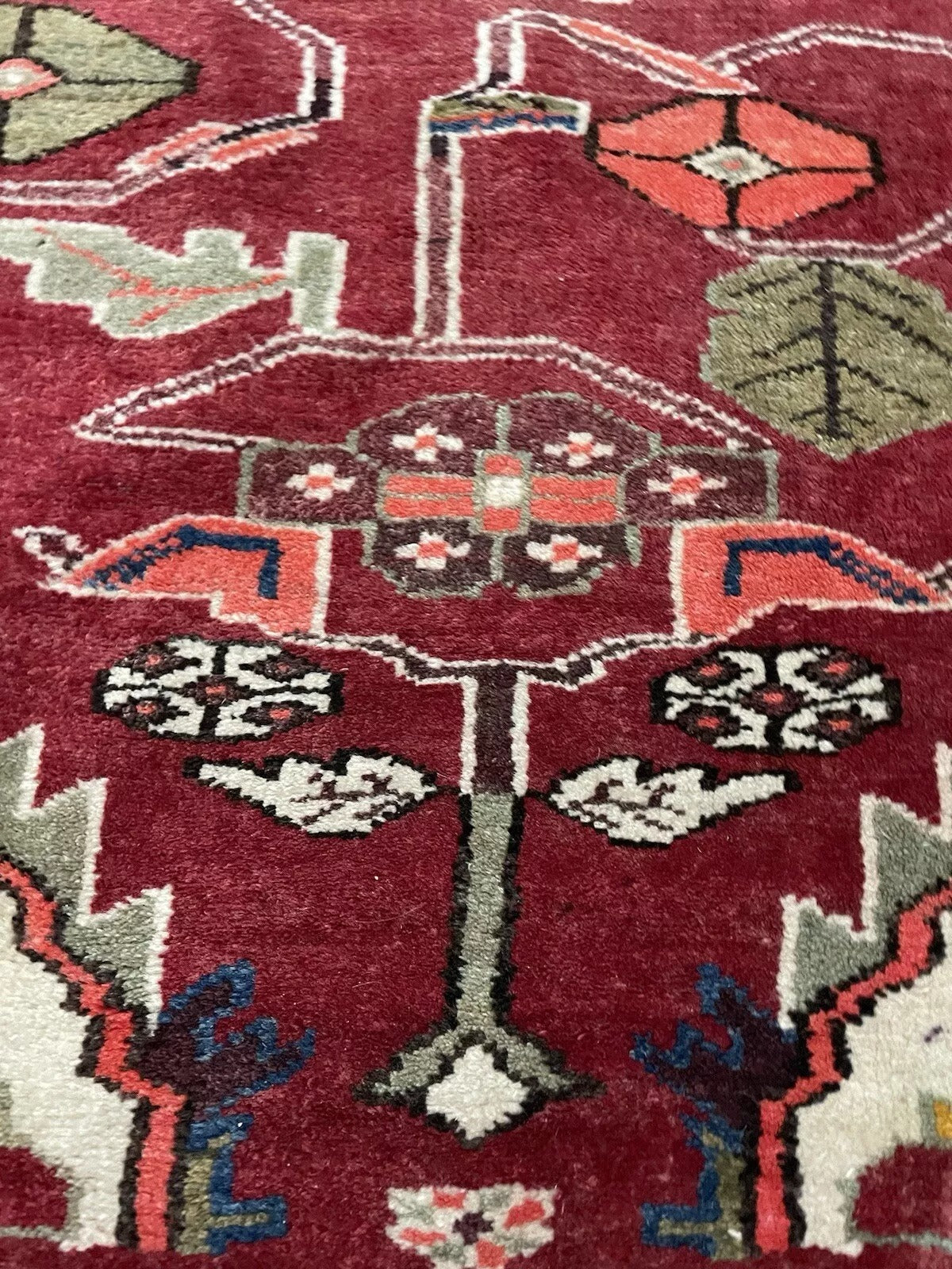 Persian Hamadan rug laid out, showcasing its intricate craftsmanship.

