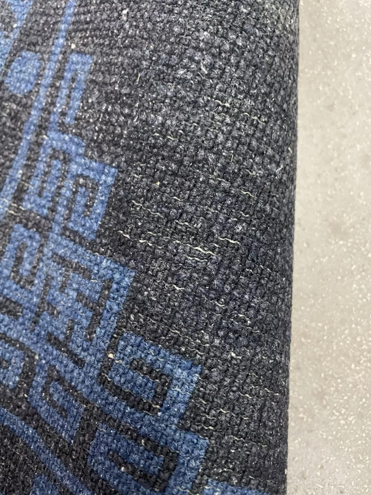 Aged texture of the early 1900s Chinese wool rug.

