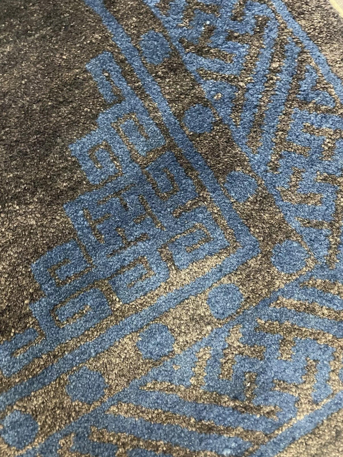 Fine details of a vintage Chinese Peking wool rug.

